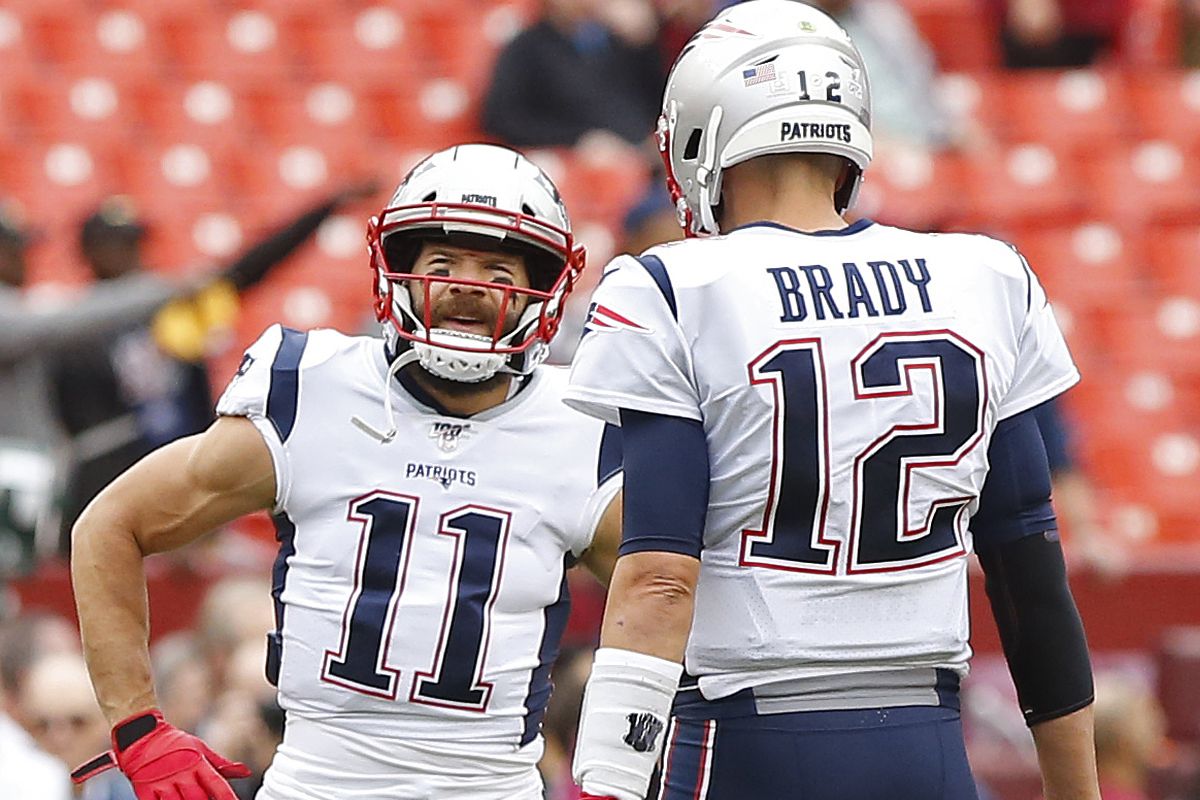 New England Patriots wide receiver Julian Edelman talks to Patriots quarterback Tom Brady during warmups prior to the Patriots game against Washington at FedExField.
