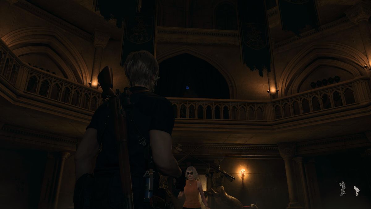Leon S Kennedy looks at a blue medallion in the southern side of the Armory area in Resident Evil 4 remake