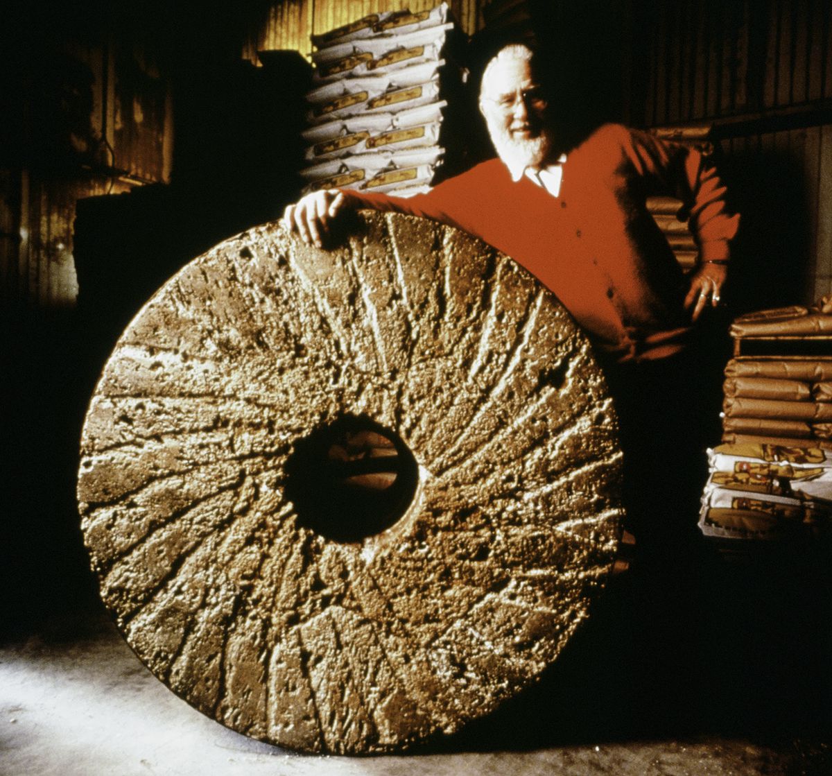 Bob Moore of Bob’s Red Mill poses with a millstone.
