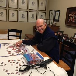 President Russell M. Nelson sits down with a puzzle in his spare time.