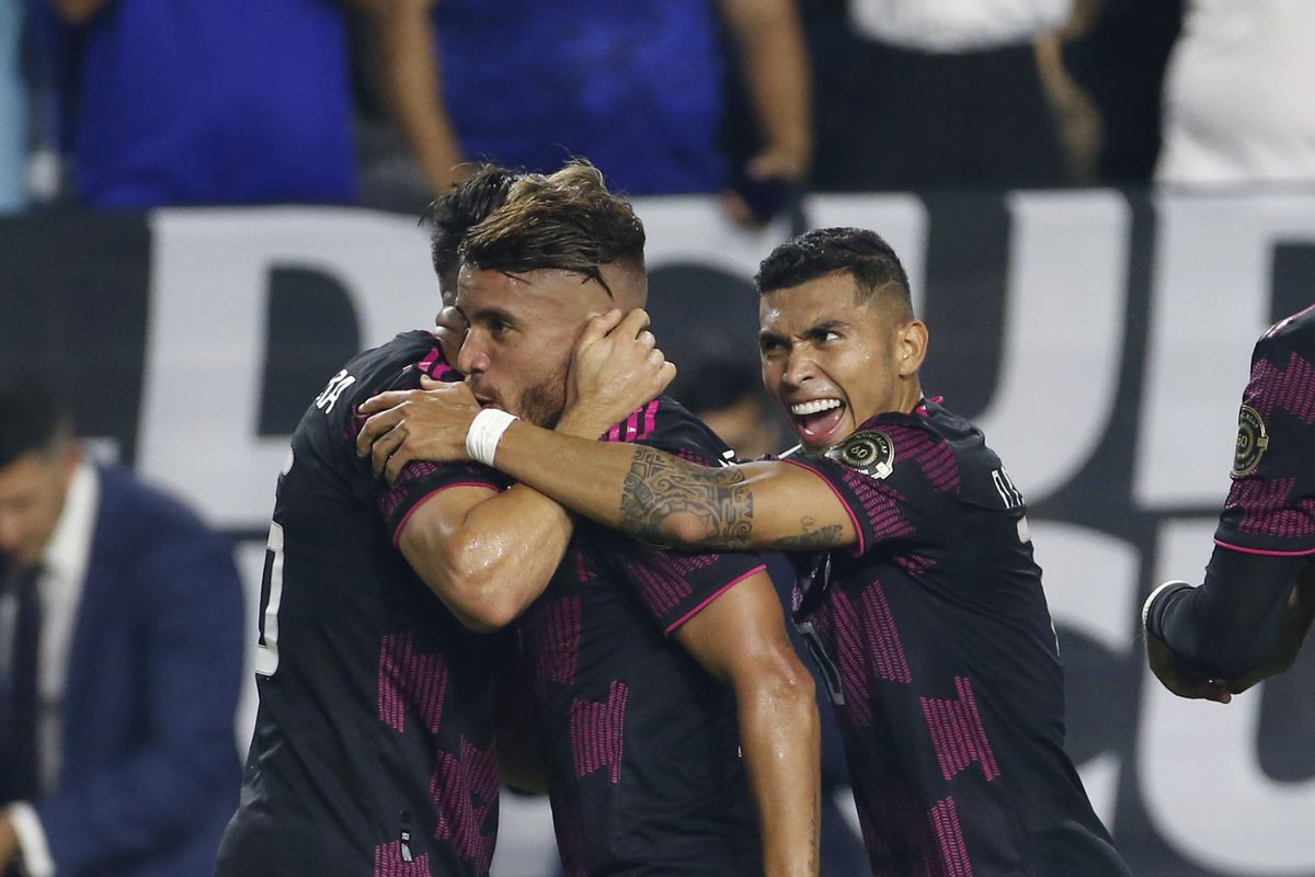 Jonathan Dos Santos #6 of Mexico (C) celebrates with Hector Herrera #16 and Orbelin Pineda #10 of Mexico after scoring a goal against Honduras during the first half of the Concacaf Gold Cup quarterfinal match at State Farm Stadium on July 24, 2021 in Glendale, Arizona.