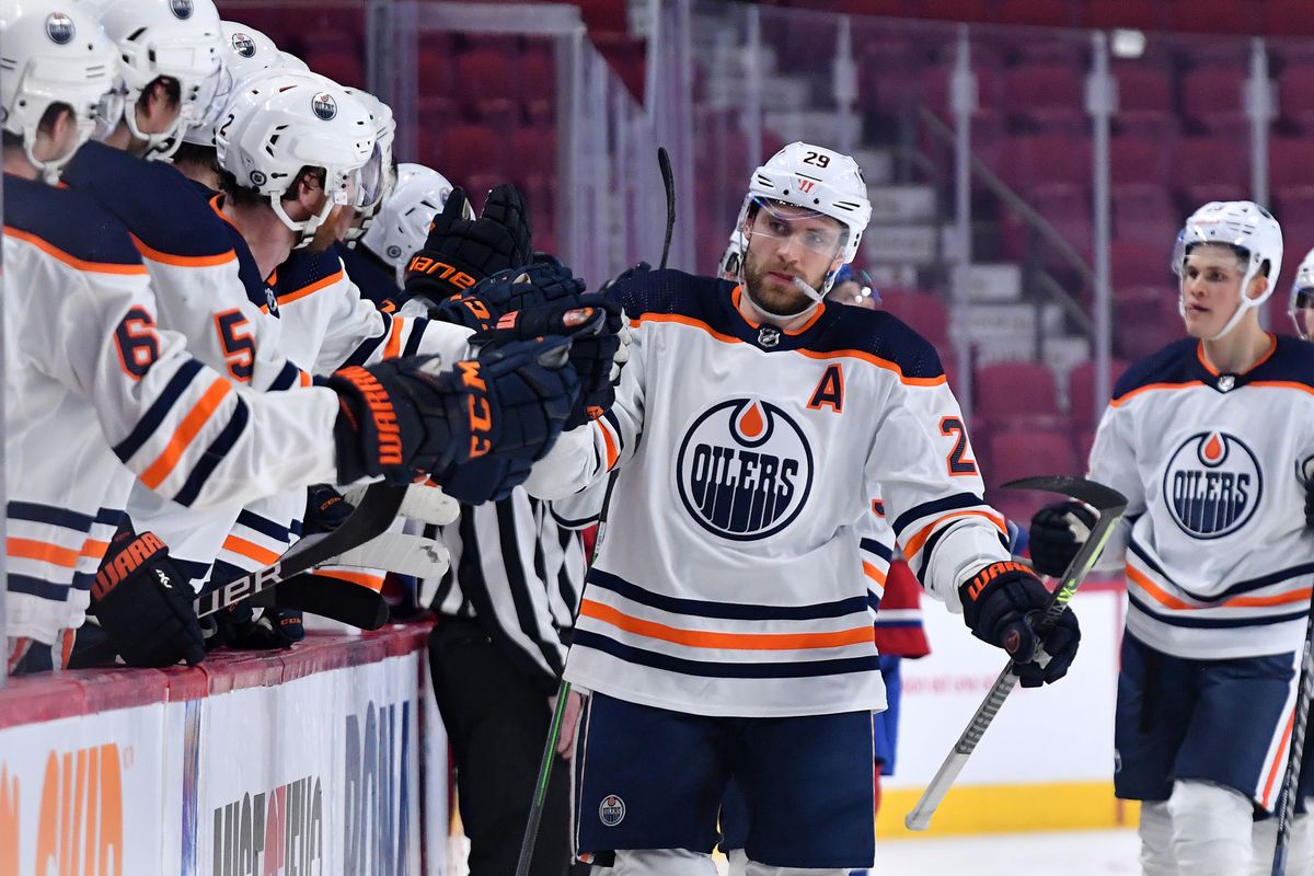 Leon Draisaitl #29 of the Edmonton Oilers celebrates with the bench after scoring a goal against the Montreal Canadiens in the NHL game at the Bell Centre on January 29, 2021 in Montreal, Quebec, Canada.