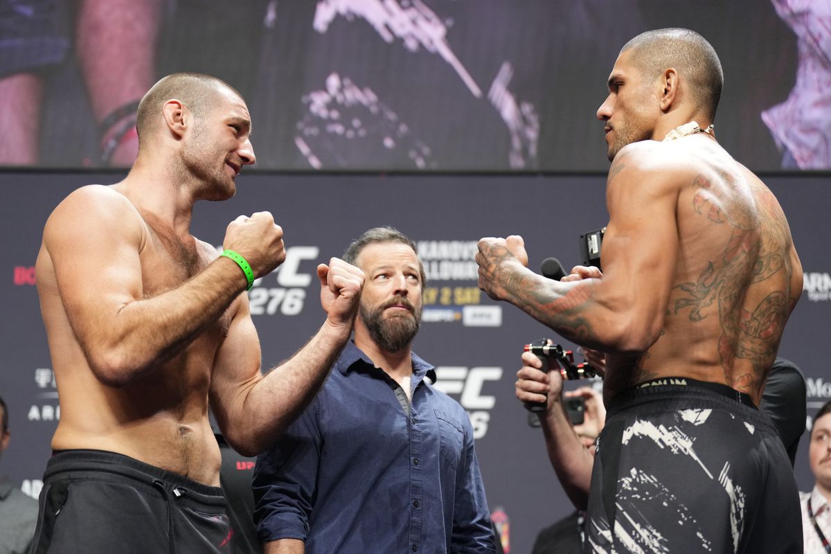 Opponents Sean Strickland and Alex Pereira of Brazil face off during the UFC 276 ceremonial weigh-in at T-Mobile Arena on July 01, 2022 in Las Vegas, Nevada.