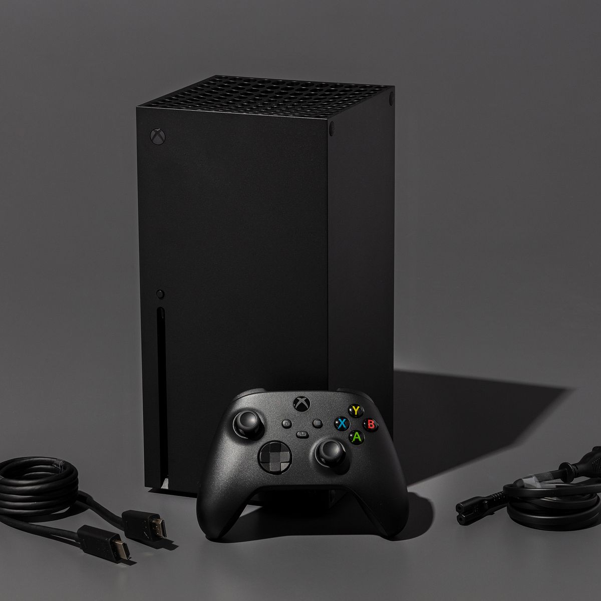 Xbox Series X video game console photographed on a dark gray background