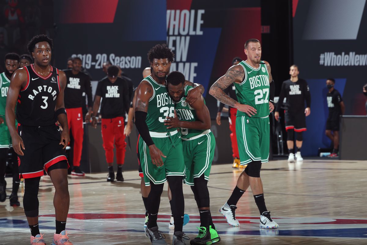 Marcus Smart and Kemba Walker of the Boston Celtics hug during the game against the Toronto Raptors during Game Three of the Eastern Conference Semifinals on September 3, 2020 in Orlando, Florida at The Field House.&nbsp;