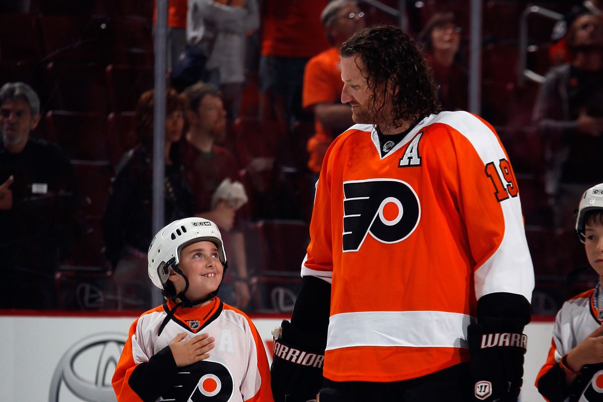 I like to imagine he's smiling because Hartnell told him that they'll listen to BSH Radio together after the game.