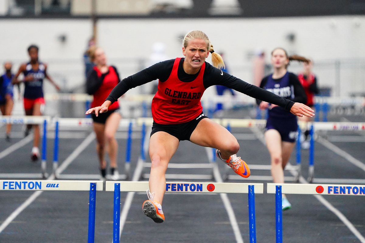 Glenbard East’s Lauren Huber wins the 300 hurdles at the Upstate Eight Conference girls track meet at Fenton.