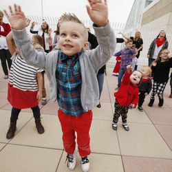 Hunter Partridge, a former patient at Primary Children's Hospital, and other children of Festival of Trees leadership wave to Santa as he arrives at the Salt Lake hospital via KSL-TV's Chopper 5 on Wednesday, Nov. 16, 2016. Santa spent time with the children playing bingo and bringing them a present.