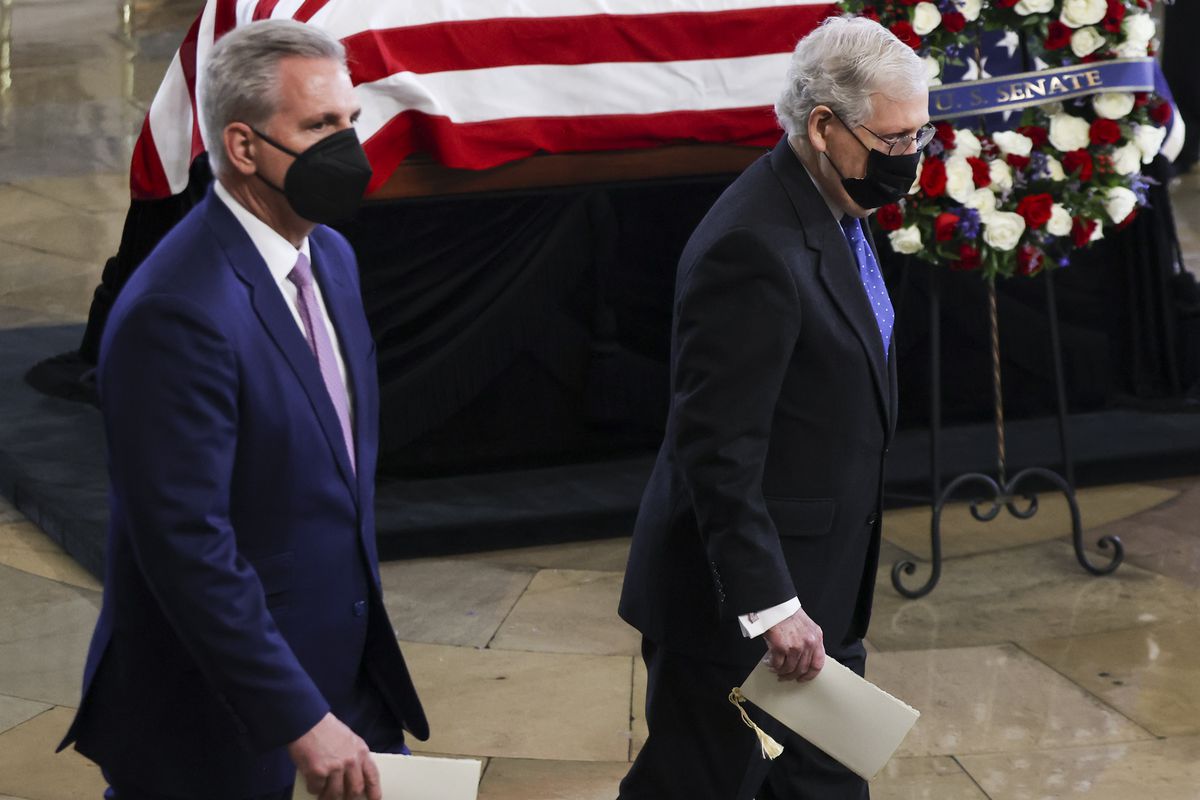 House Minority Leader Kevin McCarthy of Calif. and Senate Minority Leader Mitch McConnell of Ky., right, pay their respects to former Senate Majority Leader Harry Reid, D-Nev., during a memorial service in the Rotunda of the U.S. Capitol as Reid lies in state, Wednesday, Jan. 12, 2022, in Washington. 