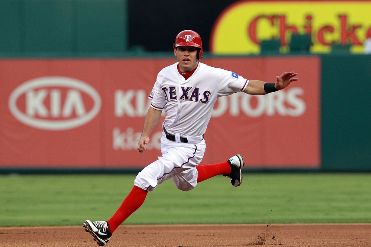 ARLINGTON, TX - MAY 25:  Ian Kinsler #5 of the Texas Rangers runs past second base at Rangers Ballpark in Arlington on May 25, 2012 in Arlington, Texas.  (Photo by Ronald Martinez/Getty Images)