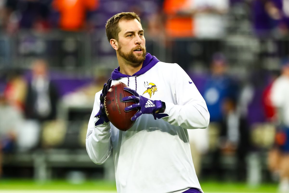 Minnesota Vikings wide receiver Adam Thielen participates in warm-ups before the start of a game against the Denver Broncos at U.S. Bank Stadium.