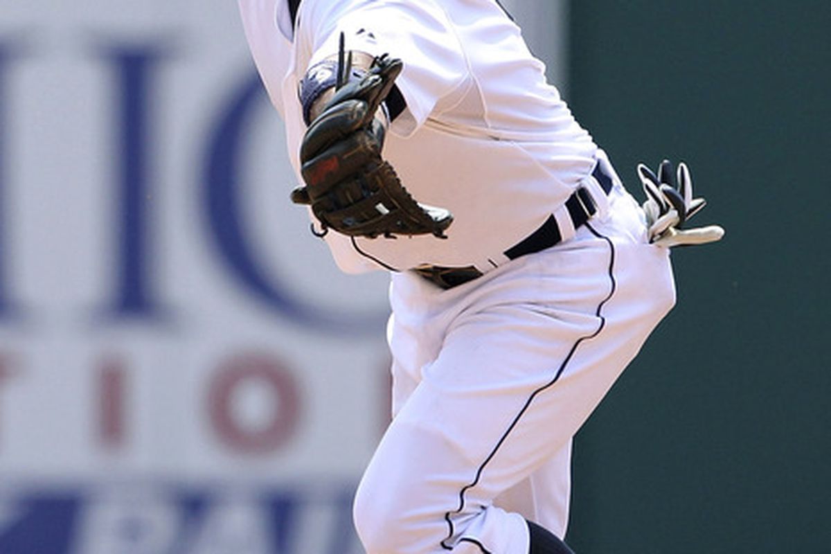 Carlos Guillen of the Detroit Tigers flips the ball over to Jhonny Peralta and turns a double play.