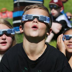 Eli Pingree and other students at Crestview Elementary in Salt Lake City watch the eclipse on Monday, Aug. 21, 2017.