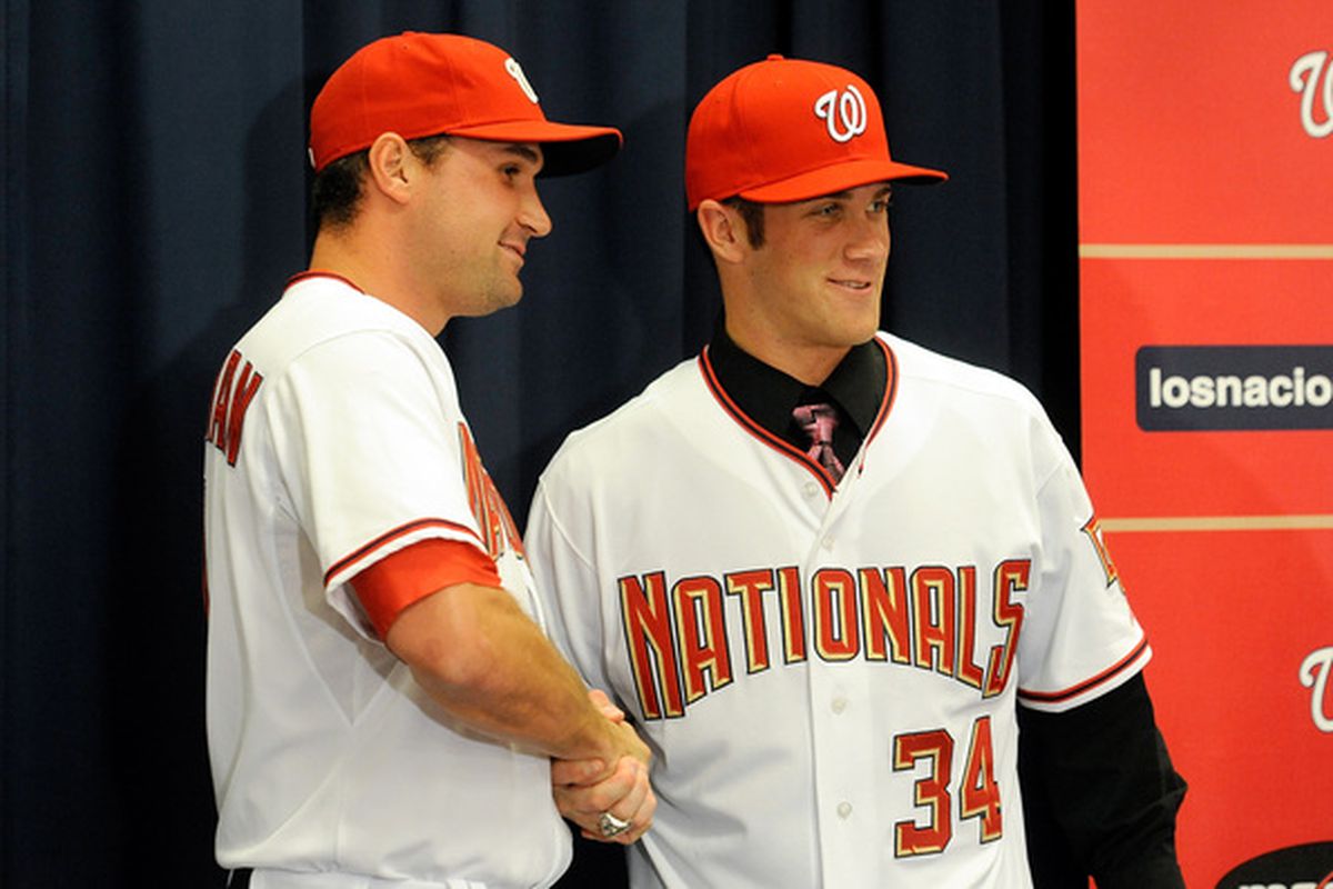 Washington Nationals' outfielder Bryce Harper #34 and third baseman Ryan Zimmerman #11, the Nats' 2010 and 2005 1st Round picks. (Photo by Greg Fiume/Getty Images)