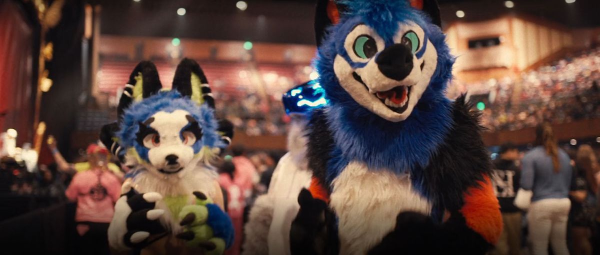 SonicFox (right) stands slightly in front of another furry (left), with both looking into the camera for the Lil Nas X documentary