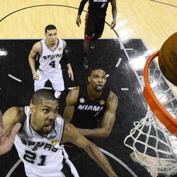 San Antonio Spurs' Tim Duncan shoots against Miami Heat during the second half at Game 5 of the NBA Finals basketball series, Sunday, June 16, 2013, in San Antonio. The Spurs won 114-104. 