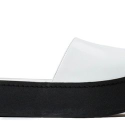 <b>Opening Ceremony</b> Double Sole Slide Sandals in White, <a href="http://www.openingceremony.us/products.asp?menuid=2&catid=16&subcatid=83&designerid=6&productid=104561">$250</a>
