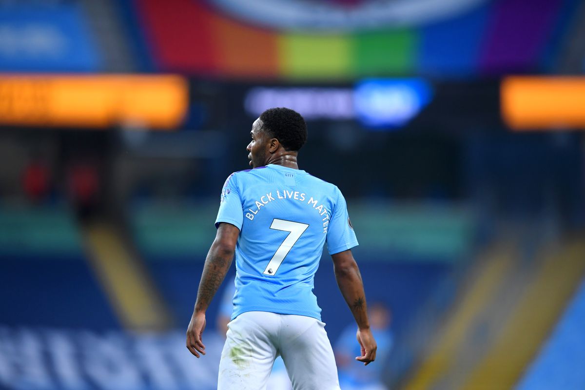 Raheem Stirling of Manchester City displays the message ‘Black Lives Matter” on his shirt during the Premier League match between Manchester City and Arsenal FC at Etihad Stadium on June 17, 2020 in Manchester, United Kingdom.