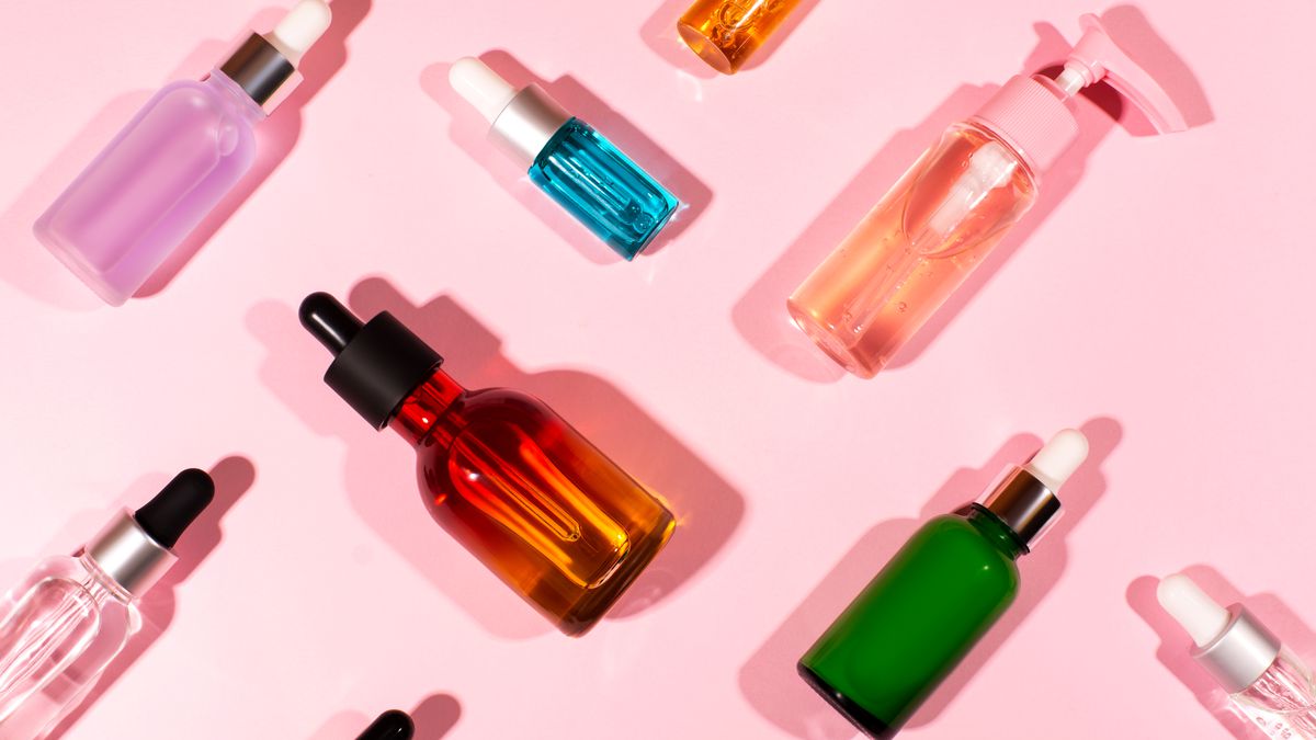 Colorful cosmetics bottles arranged on their sides in a diagonal grid.