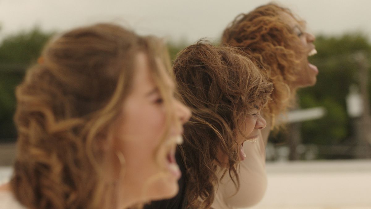 Haley Lu Richardson, Regina Hall, and Shayna McHayle scream their feelings out on a rooftop in Support The Girls.