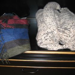 Johnstons scarf, $250<br />Raif Aadelberg shawl cardigan, $3,450
