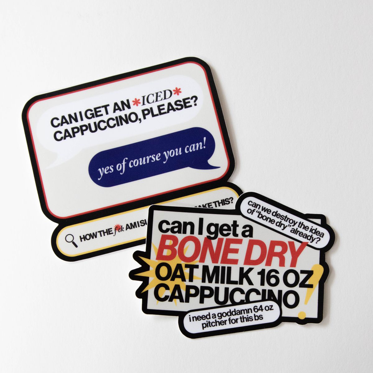 Two stickers with commentary about ordering coffee: “Can I get an *iced* cappuccino please?” and “Can I get a bone dry oat milk 16 oz cappuccino?”