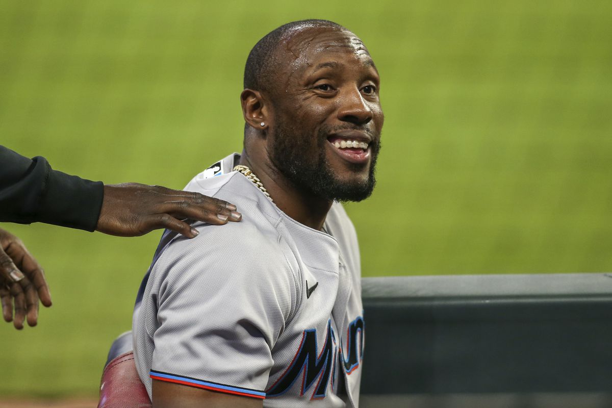 Miami Marlins center fielder Starling Marte (6) shows emotion in the dugout against the Atlanta Braves in the tenth inning at Truist Park