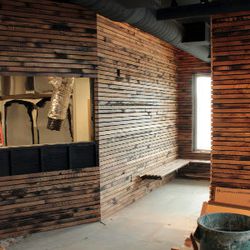 Entry/waiting area. Barn wood slat walls by Dave Puncochar with Good Wood Nashville.