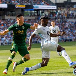 August 4, 2019 - Saint Paul, Minnesota, United States - Portland Timbers defender Jorge Moreira (2) is beat by Minnesota United defender Ike Opara (3) during the match at Allianz Field.