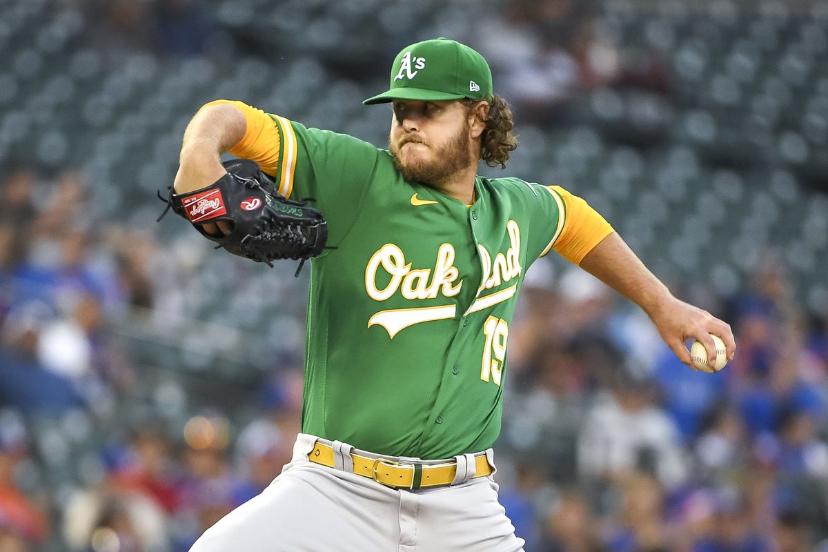 Cole Irvin #19 of the Oakland Athletics delivers a pitch against the Detroit Tigers during the bottom of the first inning at Comerica Park on August 31, 2021 in Detroit, Michigan.