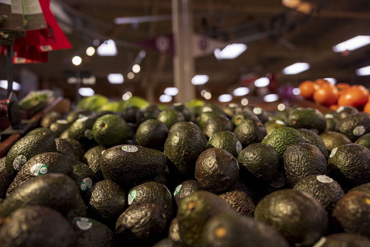 An avocado display in a grocery store