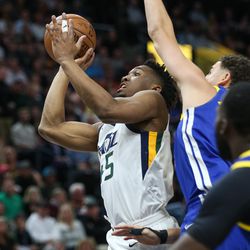 Utah Jazz guard Donovan Mitchell (45) goes to the hoop during the game against the Golden State Warriors at Vivint Arena in Salt Lake City on Tuesday, April 10, 2018.