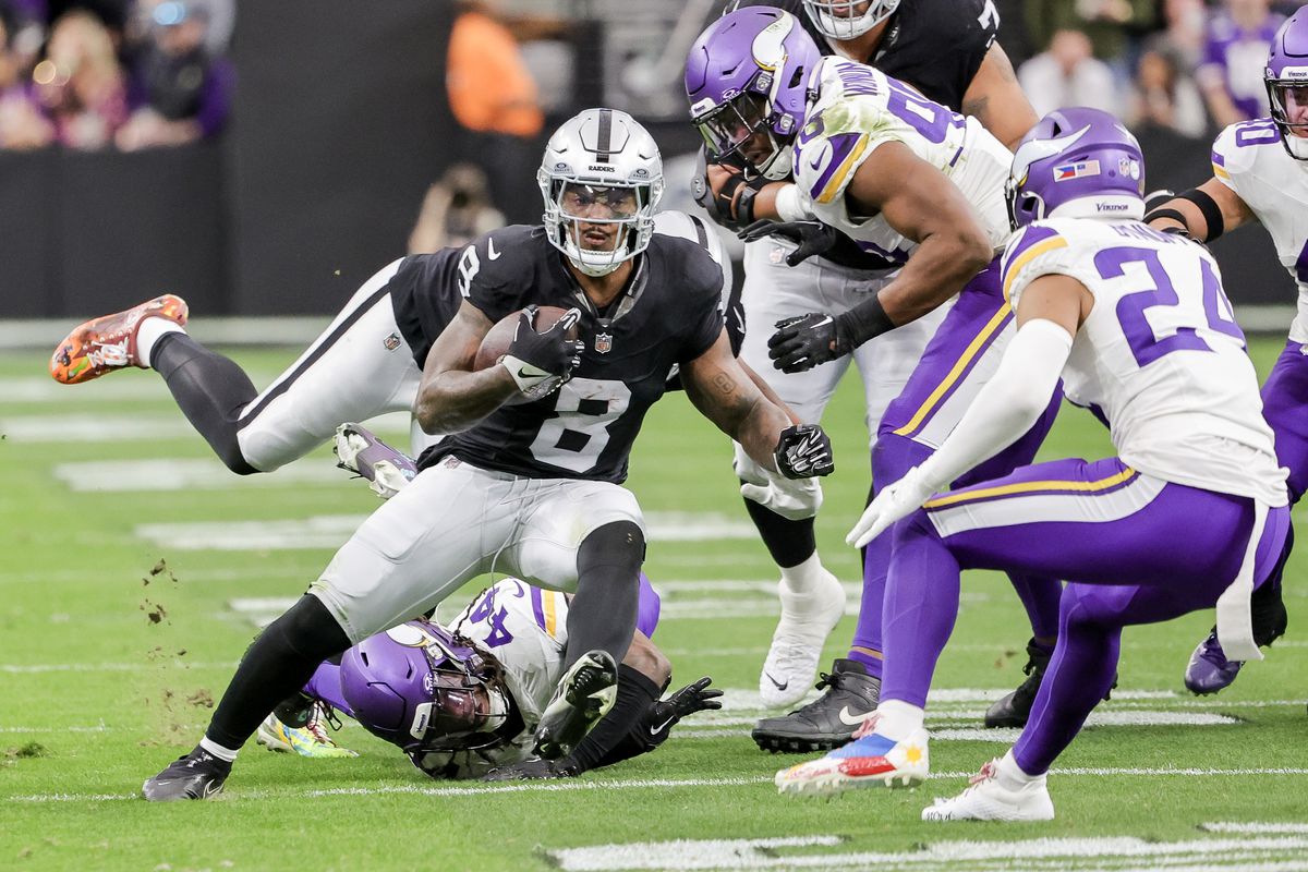Josh Jacobs #8 of the Las Vegas Raiders carries the ball during the first half of the game against the Minnesota Vikings at Allegiant Stadium on December 10, 2023 in Las Vegas, Nevada.