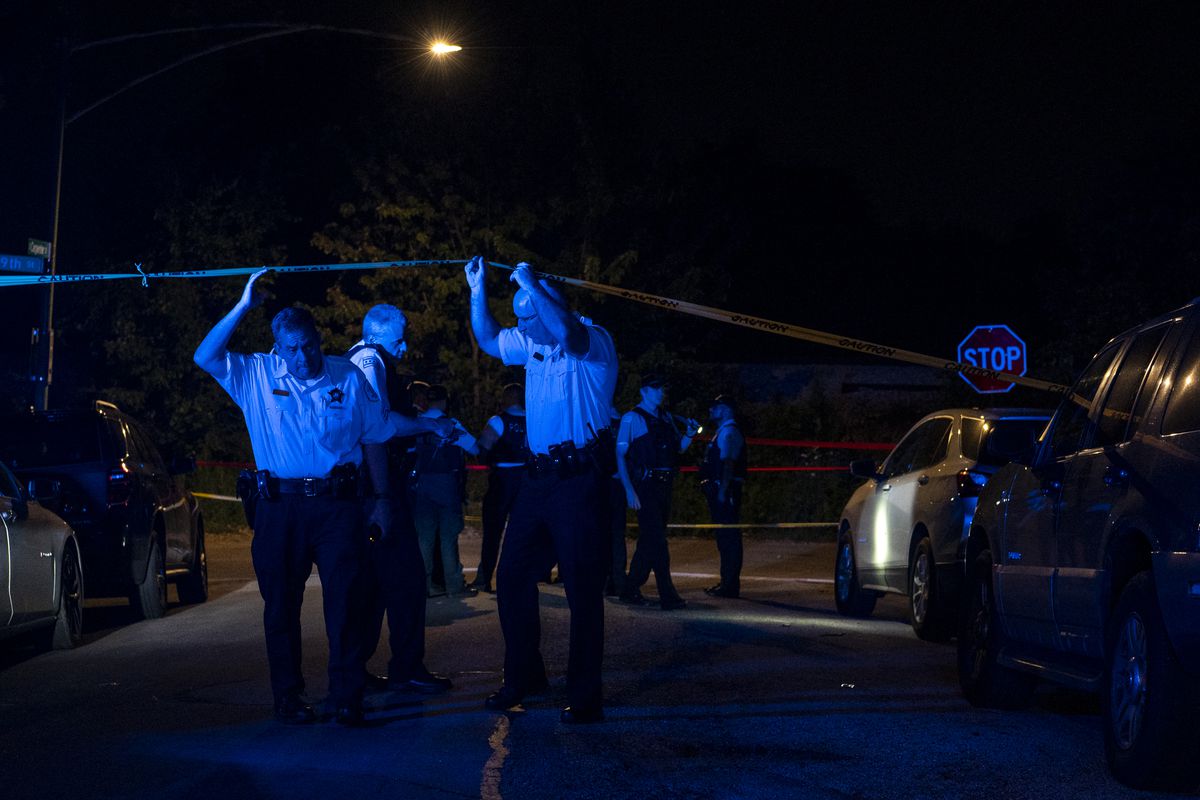 Chicago police at the scene of a shooting in the 8900 block of South Carpenter Street in Gresham Saturday where four people were shot.