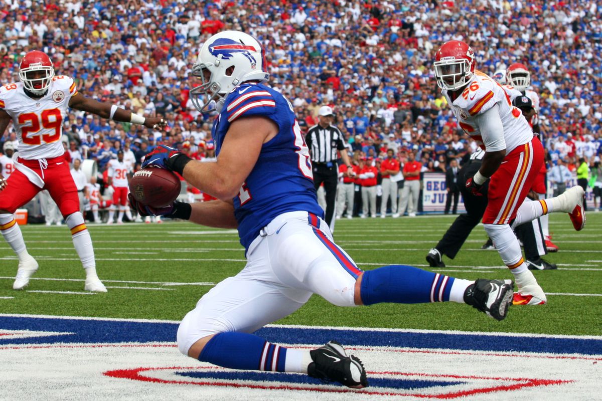 Sept. 16, 2012; Orchard Park, NY, USA;  Buffalo Bills tight end Scott Chandler (84) catches the ball for a touchdown during the first half against the Kansas City Chiefs at Ralph Wilson Stadium.  Mandatory Credit: Timothy T. Ludwig-US PRESSWIRE