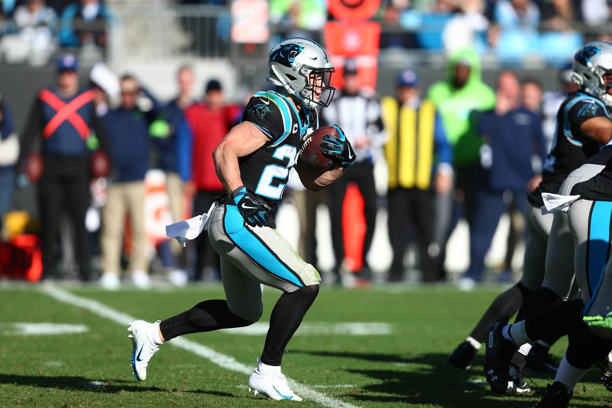 Carolina Panthers running back Christian McCaffrey carries the ball during the second quarter against the Seattle Seahawks at Bank of America Stadium.