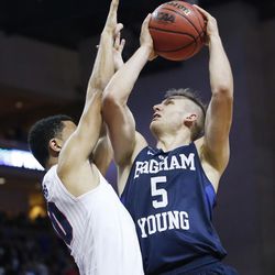 Brigham Young Cougars guard Kyle Collinsworth (5) drives on Gonzaga Bulldogs guard Bryan Alberts (10) during the WCC tournament in Las Vegas Monday, March 7, 2016. BYU lost 88-84.