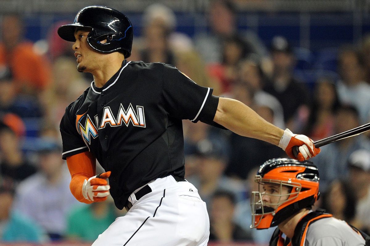May 25, 2012; Miami, FL, USA; Miami Marlins right fielder Giancarlo Stanton (27) hits an RBI single during the sixth inning against the San Francisco Giants at Marlins Park. Mandatory Credit: Steve Mitchell-US PRESSWIRE