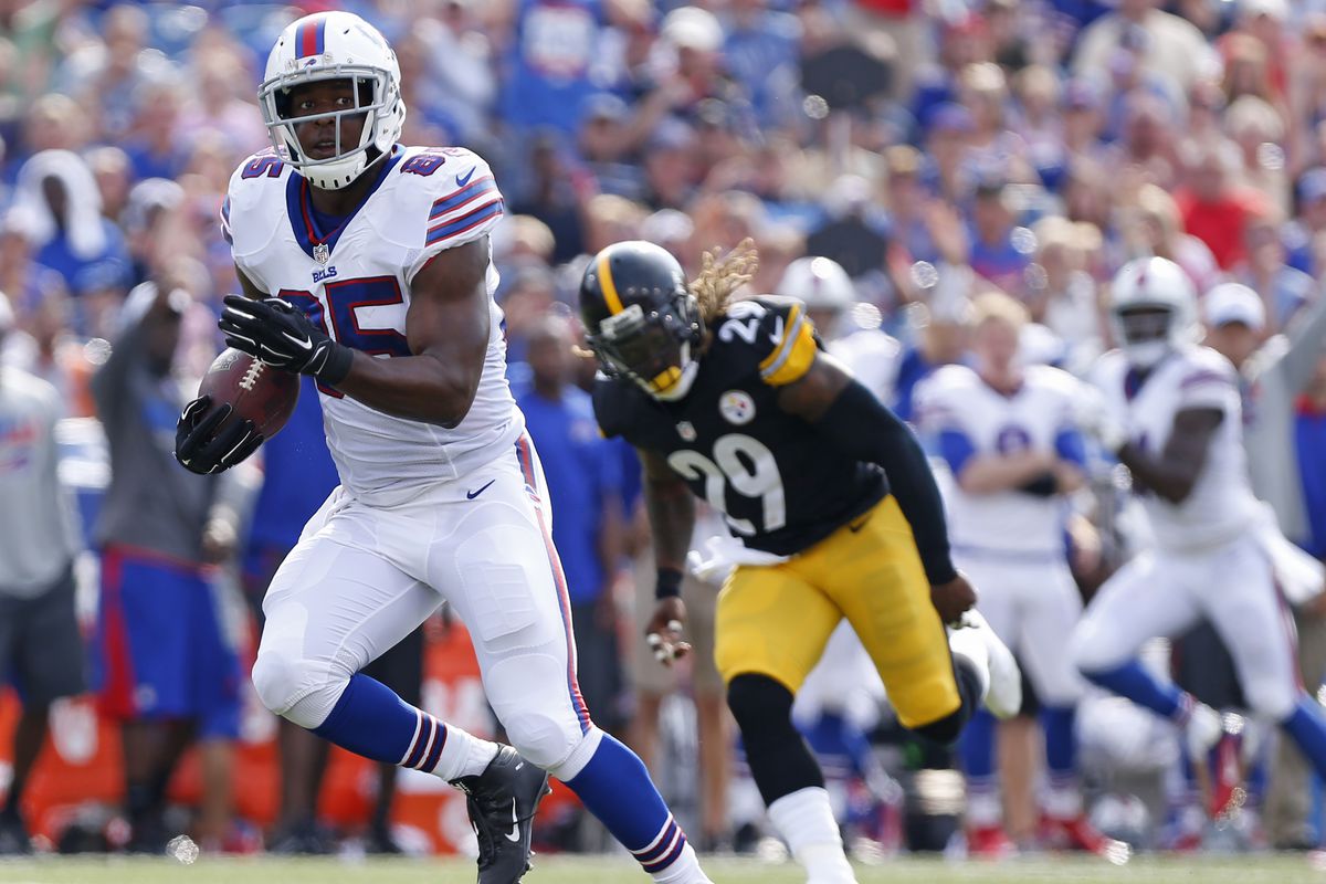 Buffalo Bills' tight end Charles Clay runs away from Steelers' safety Shamarko Thomas on his way to the end zone.