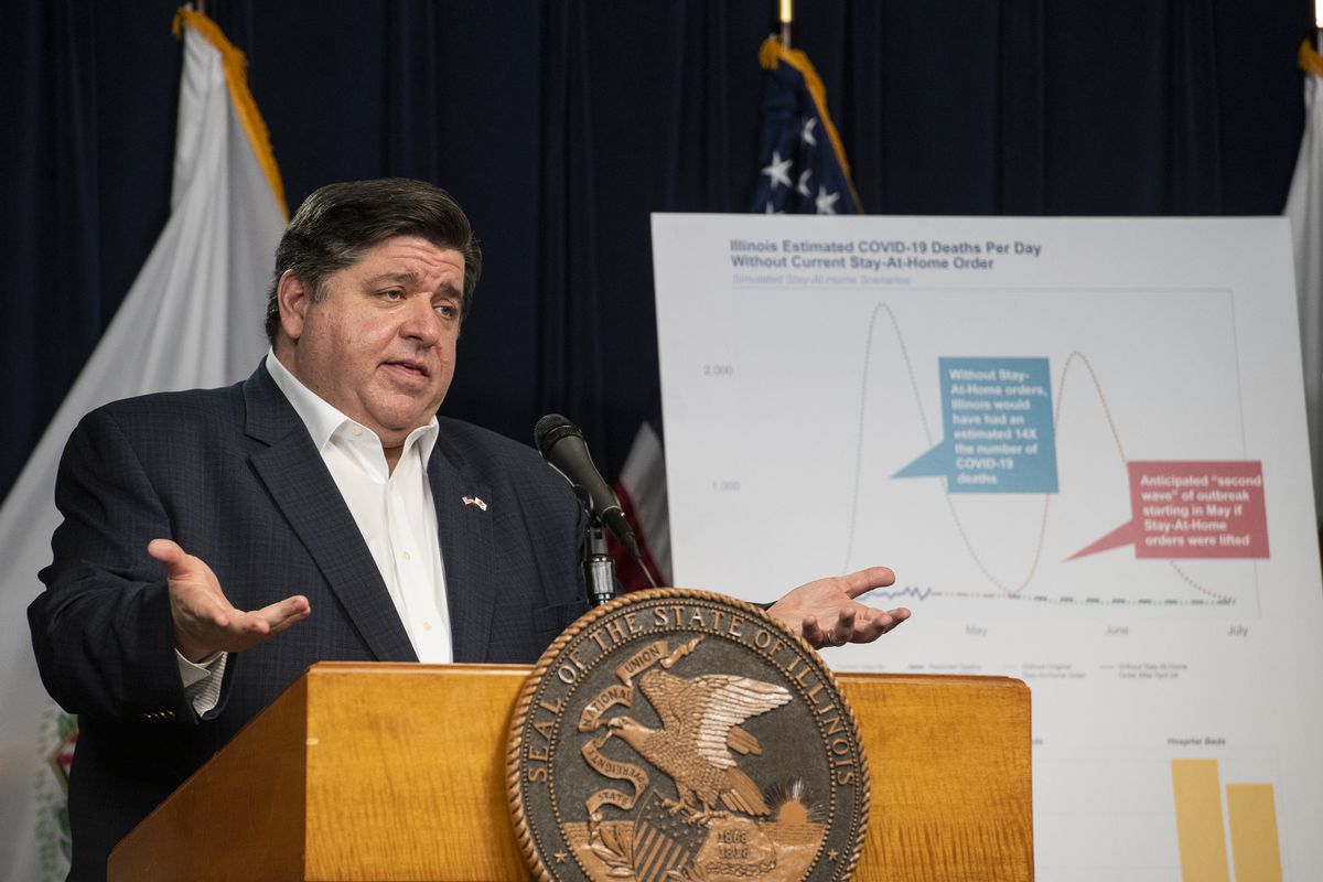 Gov. J.B. Pritzker announces an extension of the stay at home order for Illinois as well as a mandatory face covering order at his daily Illinois coronavirus update at the Thompson Center on Thursday.