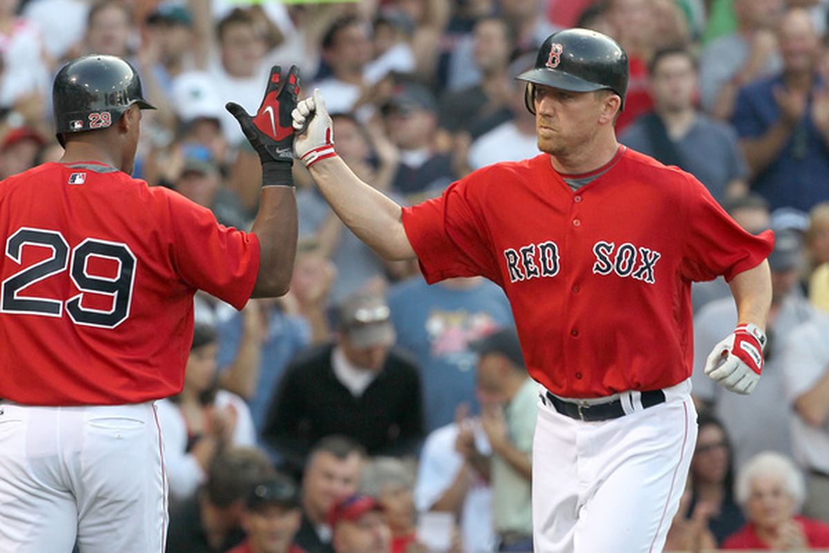 BOSTON - JUNE 18:  J.D. Drew #7 of the Boston Red Sox is greeted by Adrian Beltre #29 after Drew hit a home run against the Los Angeles Dodgers at Fenway Park on June 18, 2010 in Boston, Massachusetts. (Photo by Jim Rogash/Getty Images)