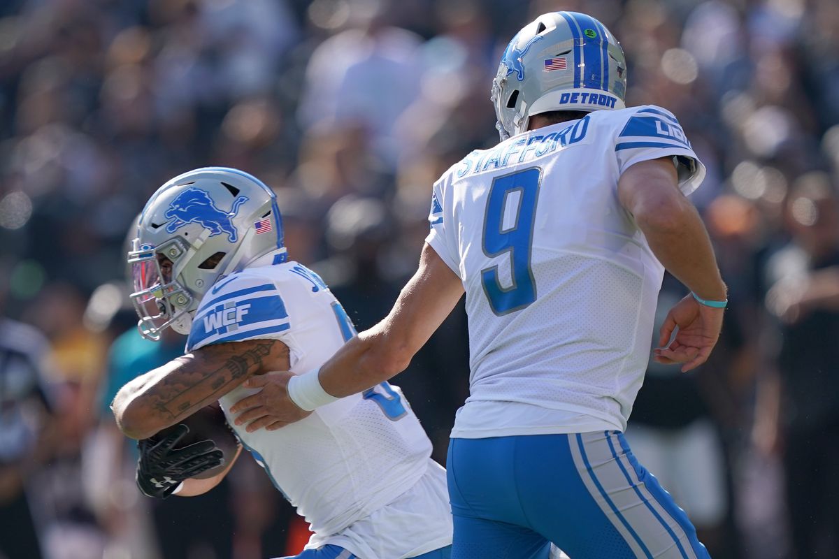 Ty Johnson of the Detroit Lions takes the handoff from Matthew Stafford against the Oakland Raiders during the first quarter of an NFL football game at RingCentral Coliseum on November 03, 2019 in Oakland, California.