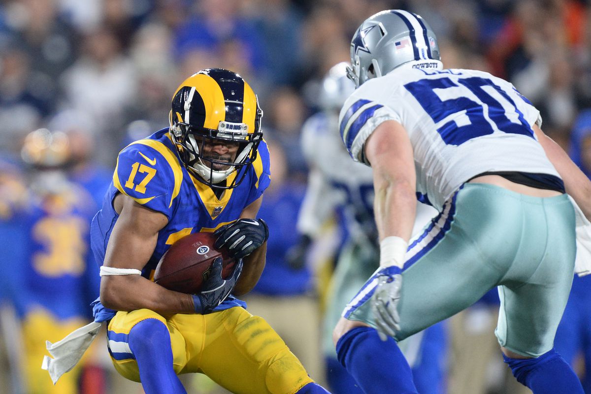Los Angeles Rams wide receiver Robert Woods runs against Dallas Cowboys outside linebacker Sean Lee in the first half in a NFC Divisional playoff football game at Los Angeles Memorial Coliseum.
