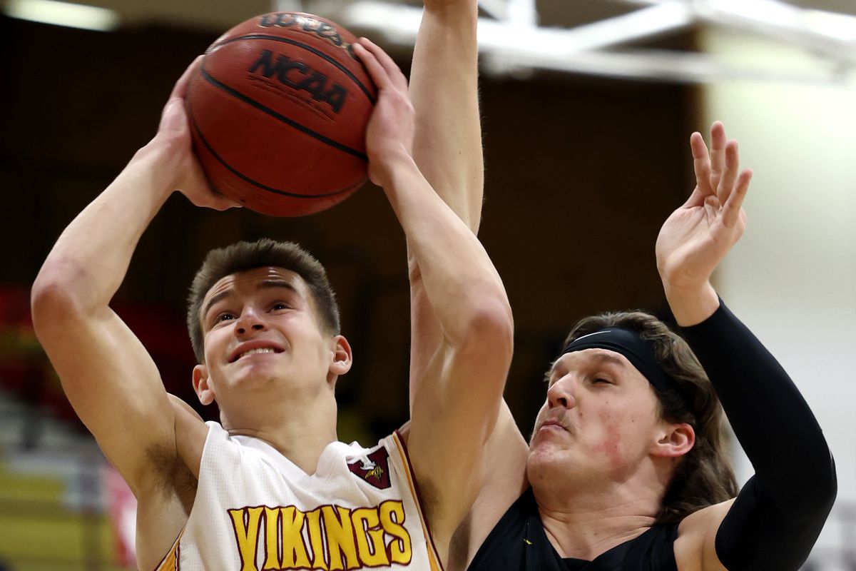 Viewmont’s Dawson Kearns goes up for a shot with Wasatch’s Cole Magnusson defending as they play in first round basketball action at Viewmont in Bountiful on Wednesday, Feb. 24, 2021.