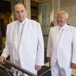 President Thomas S. Monson and Kent F. Richards of the Seventy and director of the church's temple department pause for a moment prior to entering the temple as they rededicate the Ogden temple Sunday, Sept. 21, 2014.