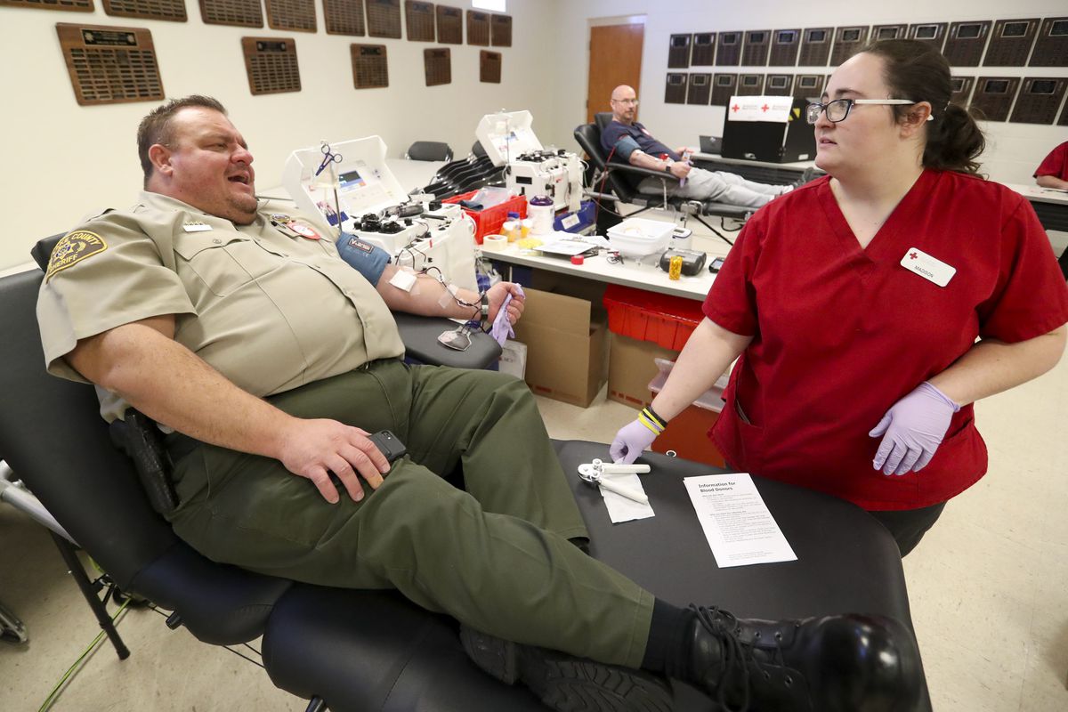 Madison Esmay, an American Red Cross collection specialist, checks on Salt Lake County Sheriff’s chief deputy Matt Dumont as he donates blood at the Salt Lake County Jail in South Salt Lake on Monday, Sept. 30, 2019. The Salt Lake County Sheriff’s Office and the Unified Police Department teamed with the American Red Cross for the event.