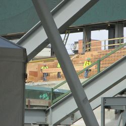 11:10 a.m. View of workers in left field from underneath the right-field bleachers - 