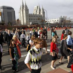 People walk to the Conference Center before the start of the 183rd Annual General Conference of The Church of Jesus Christ of Latter-day Saints on Saturday, April 6, 2013, in Salt Lake City.  The Church of Jesus Christ of Latter-day Saints is planning to build two new temples in Rio de Janeiro and Cedar City, Utah, the president of the Mormon church announced Saturday. Thomas S. Monson made the announcement in his opening address to more than 100,000 members of the church who've gathered in Salt Lake City for the church's 183rd semi-annual general conference.  (AP Photo/Rick Bowmer) 