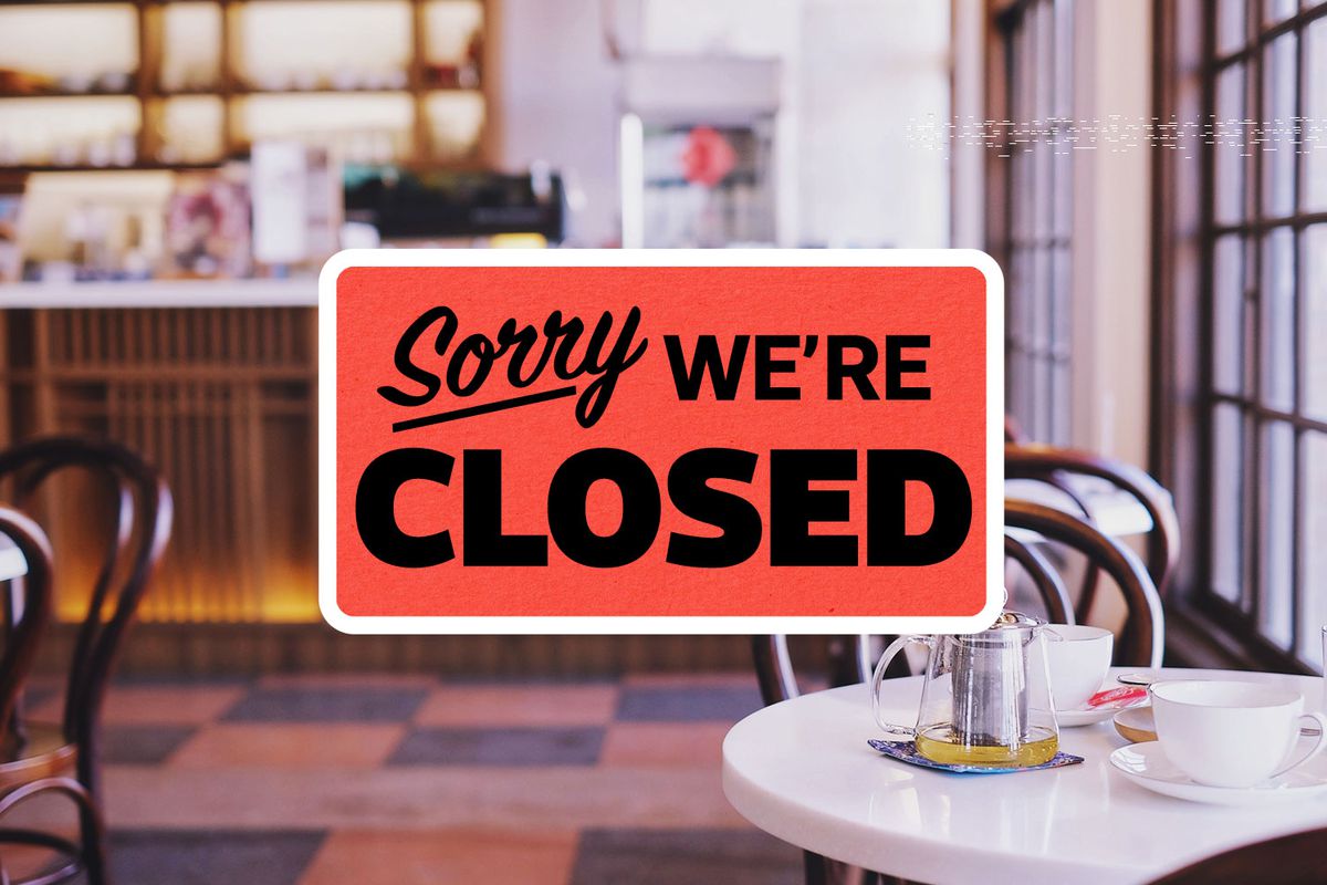 a restaurant with a sigh that says sorry we’re closed