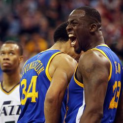 Golden State Warriors forward Draymond Green (23) celebrates after making a basket plus a foul in overtime of an NBA regular season game against the Utah Jazz at the Vivint Arena in Salt Lake City, Wednesday, March 30, 2016.